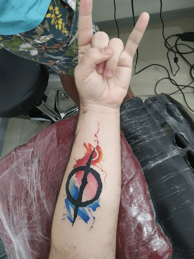 New Phyrexia symbol tattoo