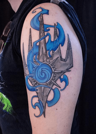 blue planeswalker mana symbol tattoo