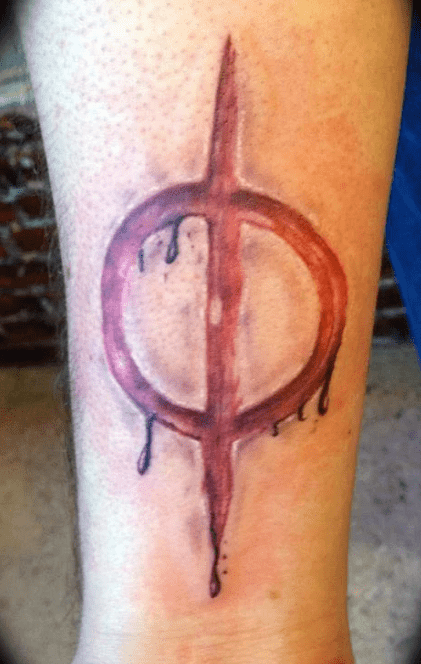 bloody New Phyrexia symbol tattoo