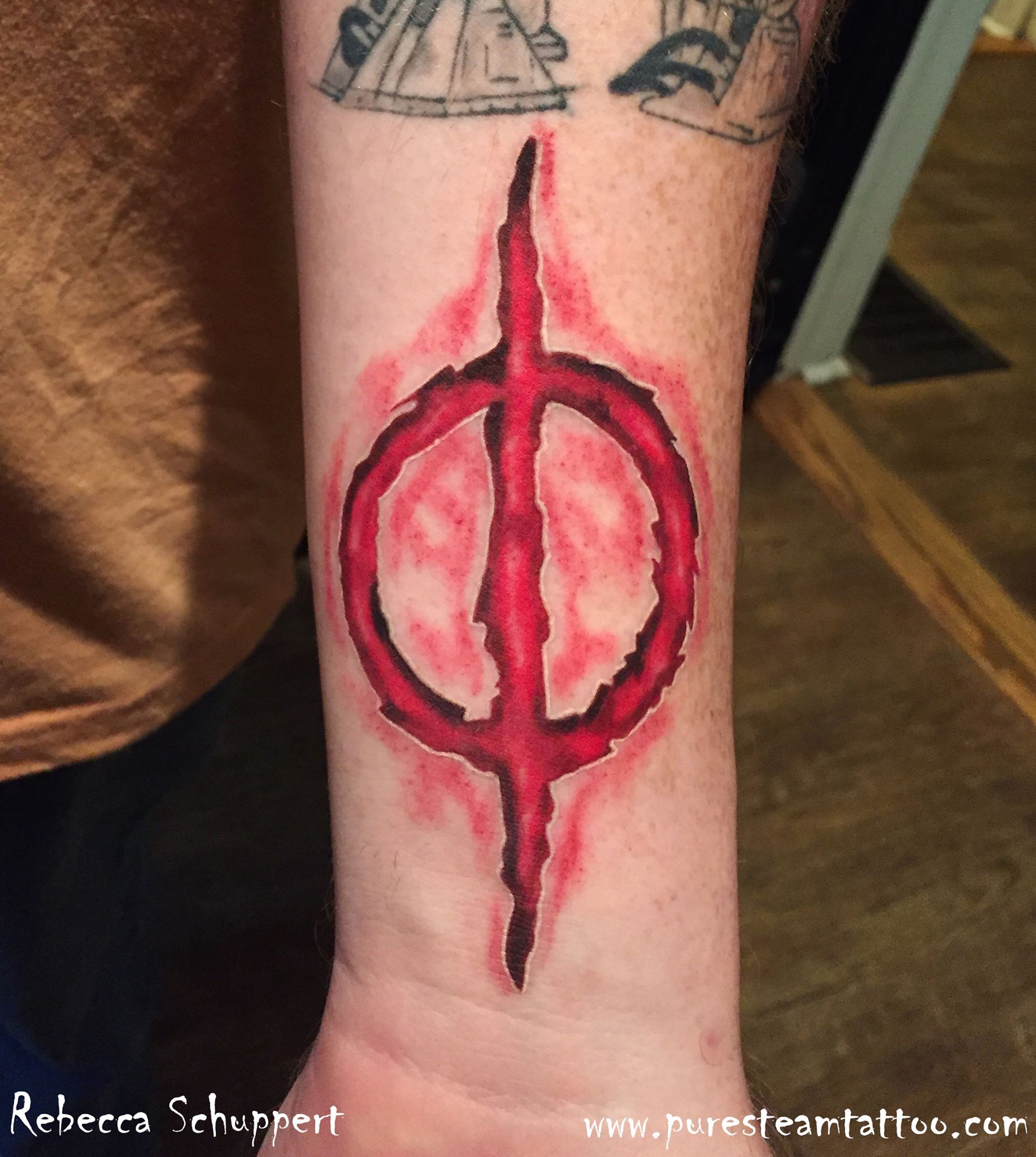 bloody New Phyrexia symbol tattoo